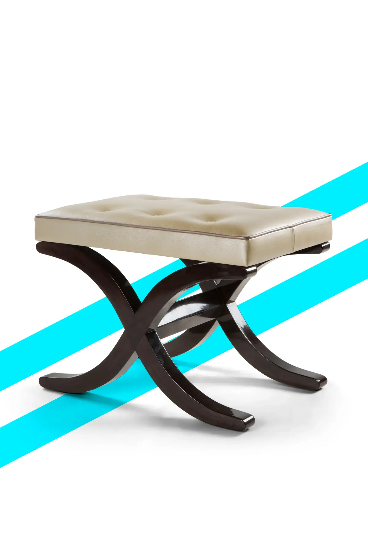 Buttoned cream leather X-frame stool, studio product photography on a graphic background