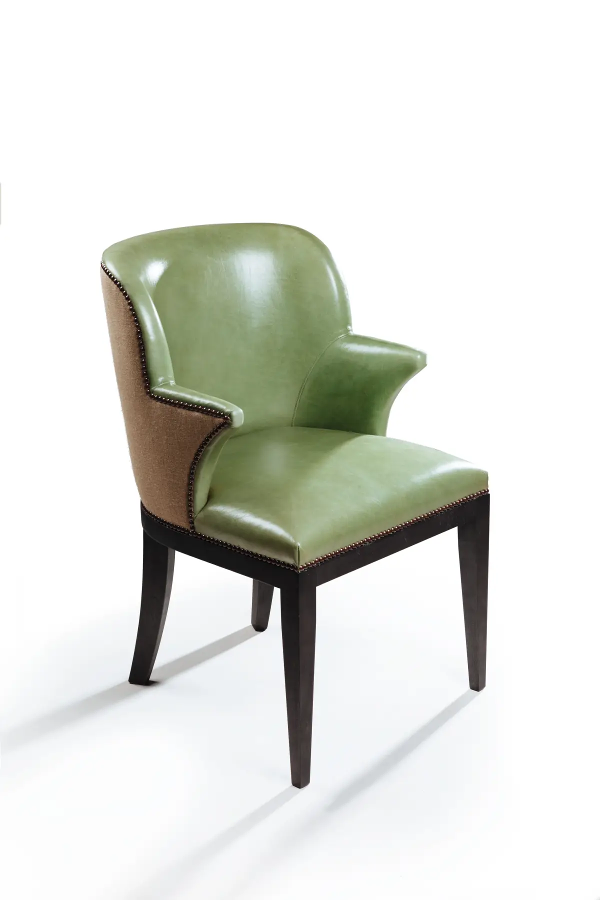 Green leather carver chair with a hessian outer back, studio product photography