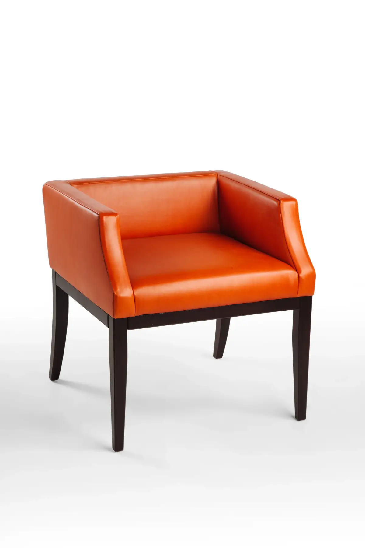 Orange leather tub armchair with a square back, studio product photography