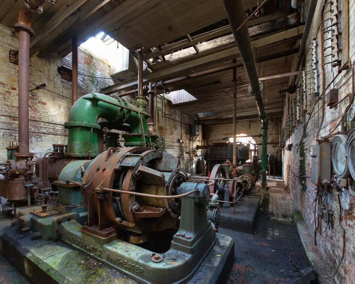 The engine house, a green painted Mather & Platt engine of Manchester make on its bedplate under a timber roof